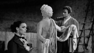Barbara Steele and Anthony Steffen in a scene from An Angel for Satan (1966) – Harriet (Steele) poses for Robert (Steffen) to aid his restoration of the statue