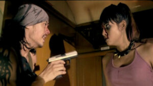 Jane Confronts Joke in a scene from Train of the Dead (2007)