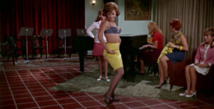 Kitty (Norma Lazareno) does a striptease for her schoolmates (Even the Wind is Afraid (1968)