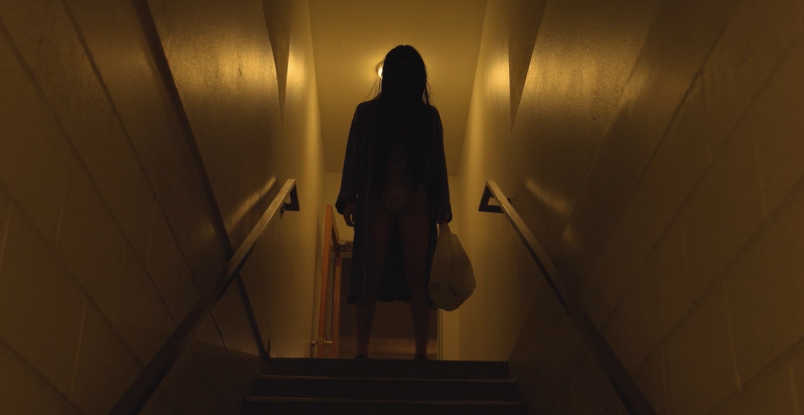 John Alan Hulbert looking creepy at the top of the stairs in Creature in the Dark