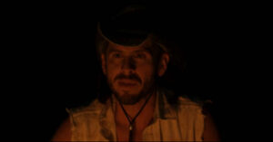 Benjamin L. Newmark as Roger in the 2023 horror film Forest of Death