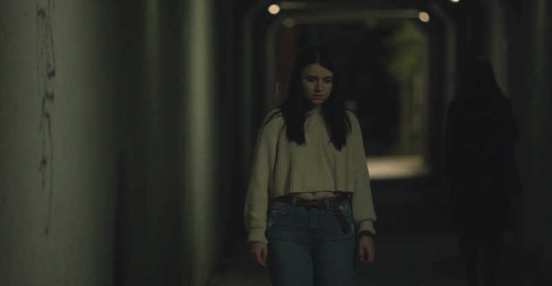 Jennifer Buckley has an unfortunate encounter in a dark tunnel in the Lucky Girl segment of The Seven Darks (2024)