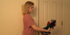 Allison Pringle (with demon doll) in a scene from Believe it or Not