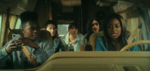Kamarion Miller, Triston Dye, Evelyn Kim, Selena Turner, and Lauren Chanel in a scene from the Tubi horror film Tarot Curse (2025)